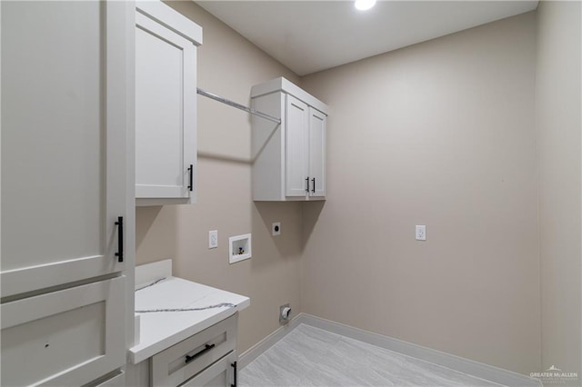 3905 Tierra Escondida, Weslaco, TX 78596 - laundry area featuring cabinet space, baseboards, hookup for an electric dryer, and washer hookup