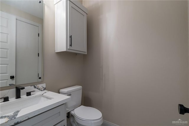 3905 Tierra Escondida, Weslaco, TX 78596 - half bath featuring toilet, vanity, and baseboards