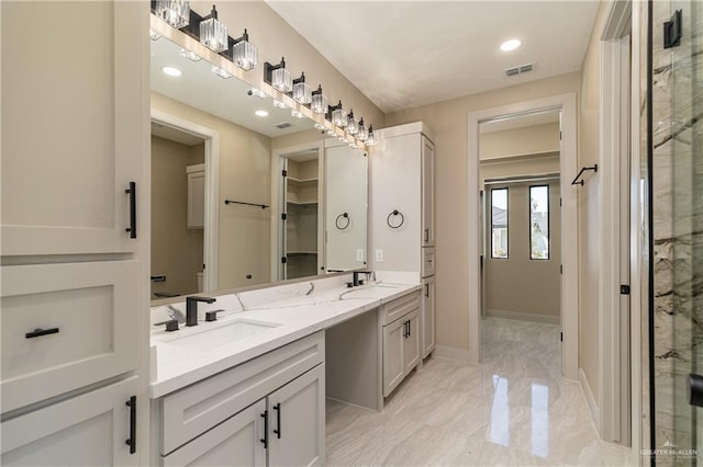 3905 Tierra Escondida, Weslaco, TX 78596 - full bath with visible vents, marble finish floor, a sink, a stall shower, and double vanity