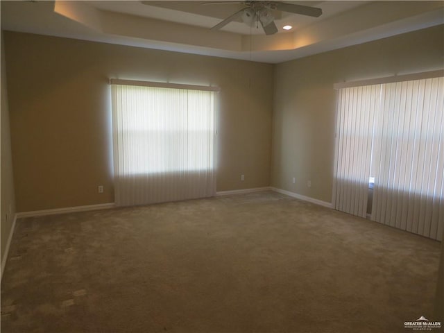 2603 Norma Dr, Mission, TX 78574 - empty room featuring ceiling fan, a raised ceiling, and carpet floors