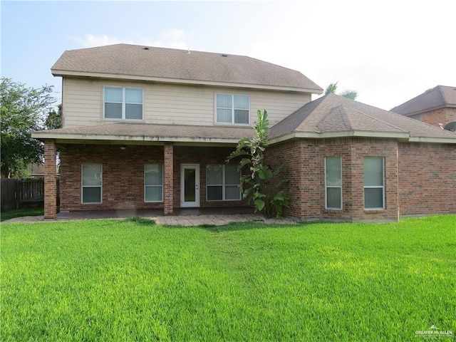 2603 Norma Dr, Mission, TX 78574 - rear view of property with a patio area, brick siding, and a shingled roof