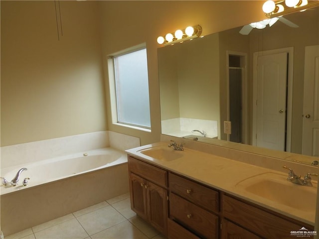 2603 Norma Dr, Mission, TX 78574 - bathroom featuring a bath, double vanity, tile patterned flooring, and a ceiling fan