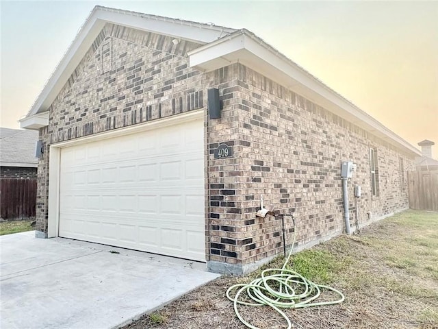 409 S Mina De Oro St, Mission, TX 78572 - garage featuring concrete driveway
