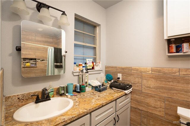 bathroom featuring vanity and walk in shower