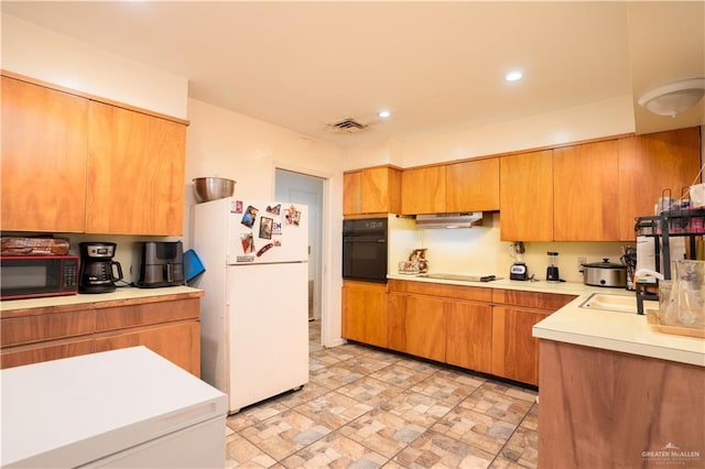 kitchen featuring sink and black appliances