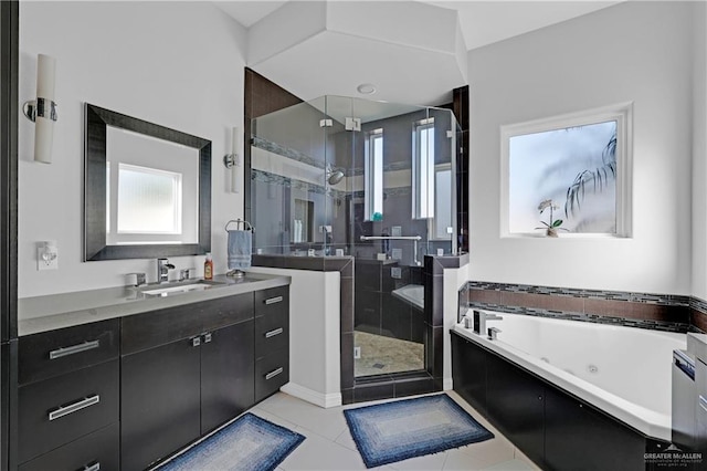 bathroom featuring a whirlpool tub, a shower stall, tile patterned flooring, and vanity