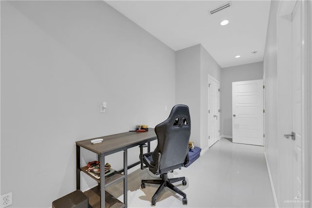 home office with recessed lighting, visible vents, and baseboards