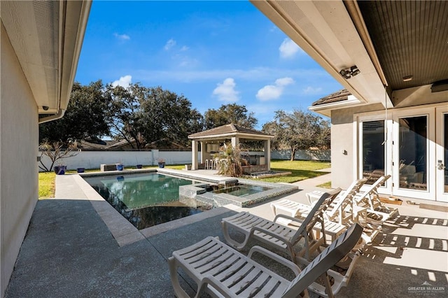 view of swimming pool featuring a fenced backyard, a gazebo, french doors, a patio area, and a pool with connected hot tub