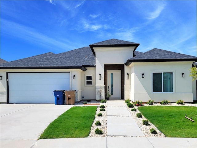 view of front of home with a garage and a front yard