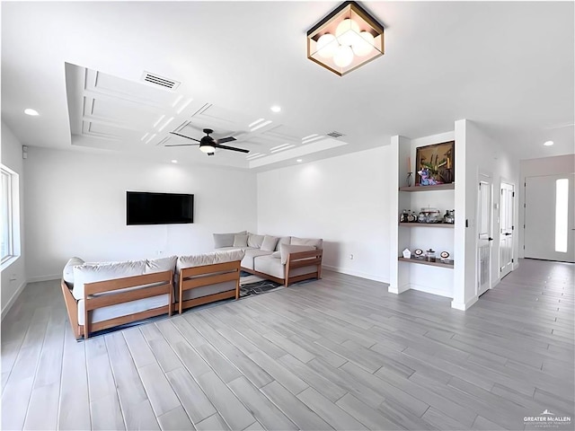 unfurnished living room featuring ceiling fan and light hardwood / wood-style floors