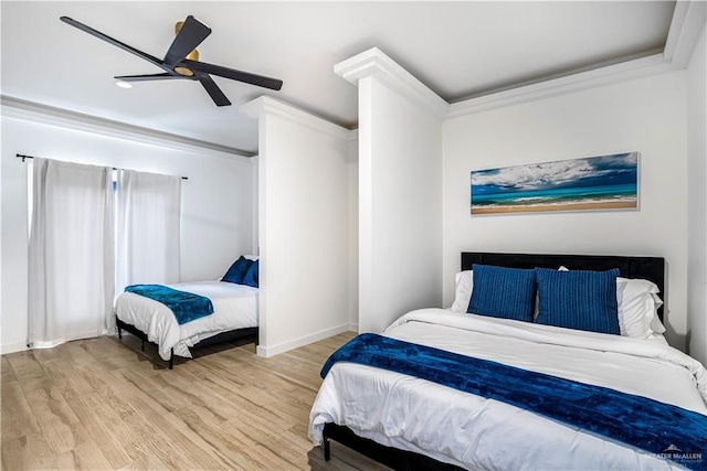 bedroom with ceiling fan, crown molding, and hardwood / wood-style flooring