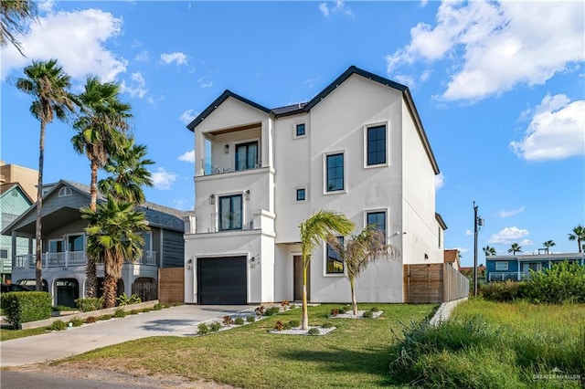 view of front of property with a front yard and a garage