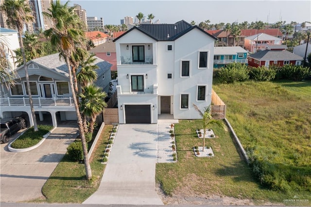 view of front of home featuring a front lawn and a garage