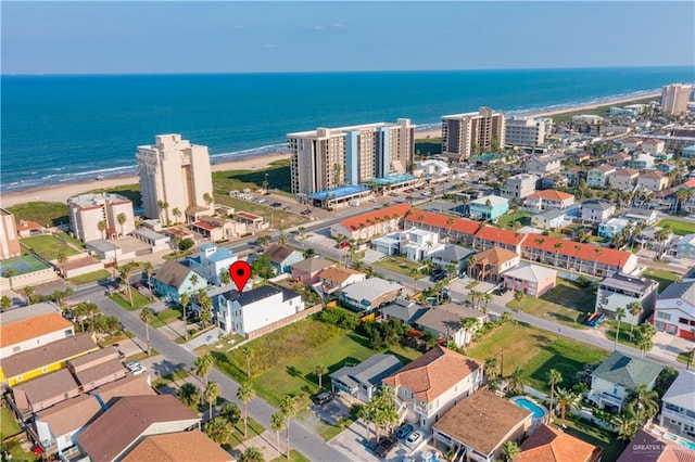 bird's eye view featuring a view of the beach and a water view