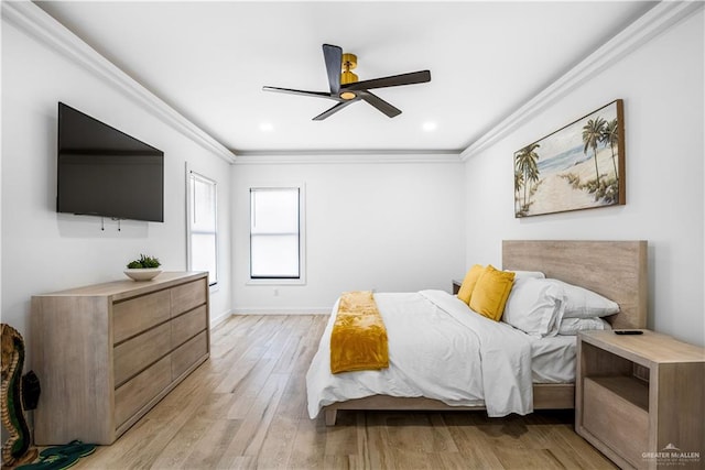 bedroom featuring ceiling fan, ornamental molding, and light wood-type flooring