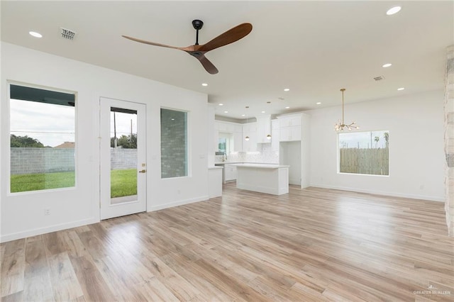 5706 N 44th Ln, Mcallen, TX 78504 - unfurnished living room featuring plenty of natural light, a ceiling fan, light wood-style flooring, and recessed lighting
