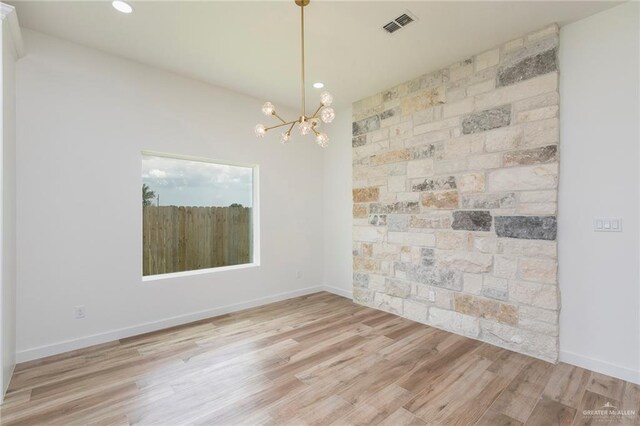 5706 N 44th Ln, Mcallen, TX 78504 - spare room with a chandelier, light wood-type flooring, and recessed lighting