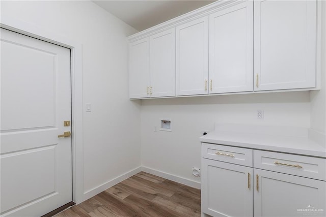 5706 N 44th Ln, Mcallen, TX 78504 - laundry area with cabinet space, hookup for a washing machine, and wood finished floors
