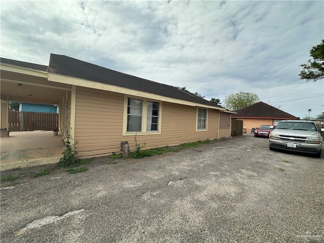 view of side of property with fence