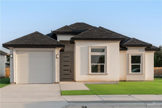 3216 E Alexa St, Edinburg, TX 78542 - view of front of property featuring driveway, an attached garage, stucco siding, and roof with shingles