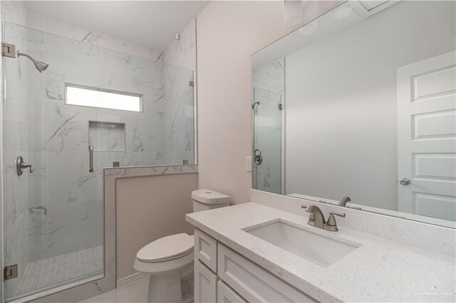 3216 E Alexa St, Edinburg, TX 78542 - bathroom featuring toilet, a marble finish shower, vanity, and marble look tile flooring