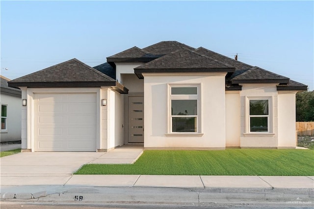 3216 E Alexa St, Edinburg, TX 78542 - view of front of property featuring an attached garage, concrete driveway, a shingled roof, stucco siding, and a front yard