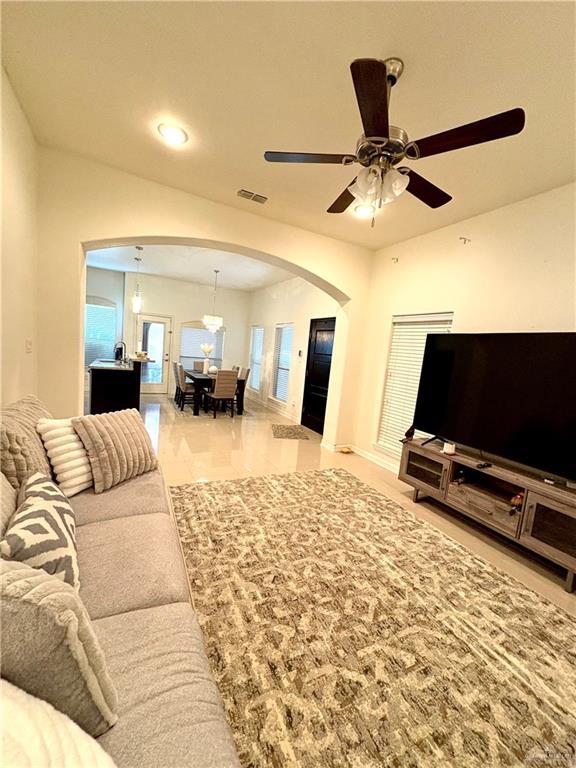 living room with ceiling fan