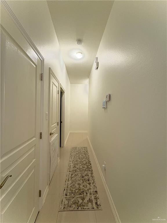 hallway with light tile patterned flooring