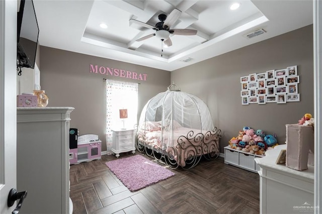 bedroom with a raised ceiling, ceiling fan, and dark parquet floors