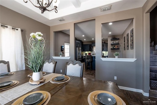 dining room featuring a notable chandelier