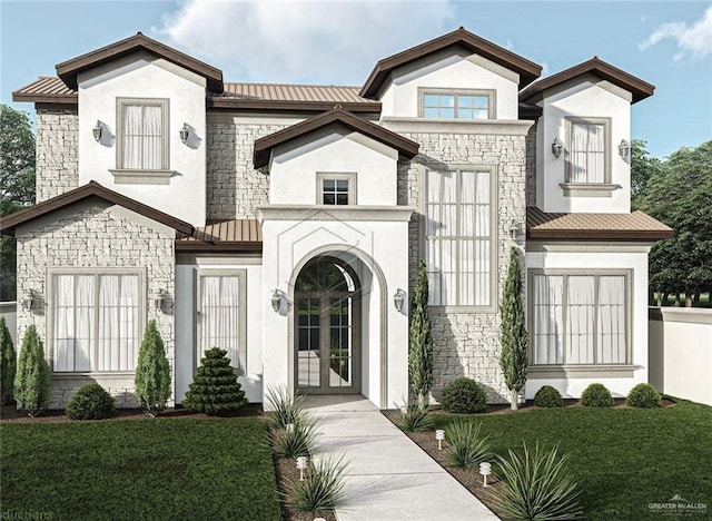 view of front of house with a front yard and french doors