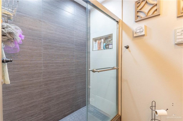 bathroom featuring an enclosed shower