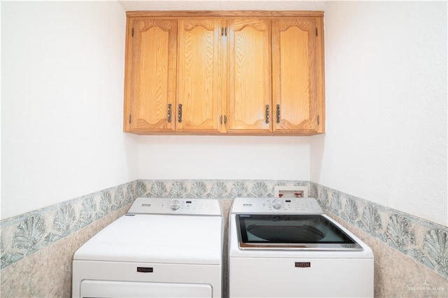 151 Tulip St, Mission, TX 78504 - laundry room with washing machine and clothes dryer and cabinet space