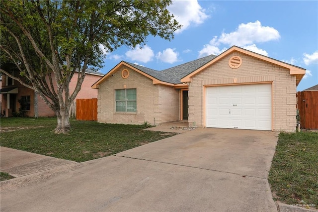 1103 Sun Valley St, San Juan, TX 78589 - ranch-style home with brick siding, a garage, and driveway