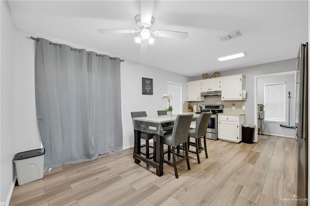 1103 Sun Valley St, San Juan, TX 78589 - dining space with light wood-style floors, ceiling fan, and baseboards