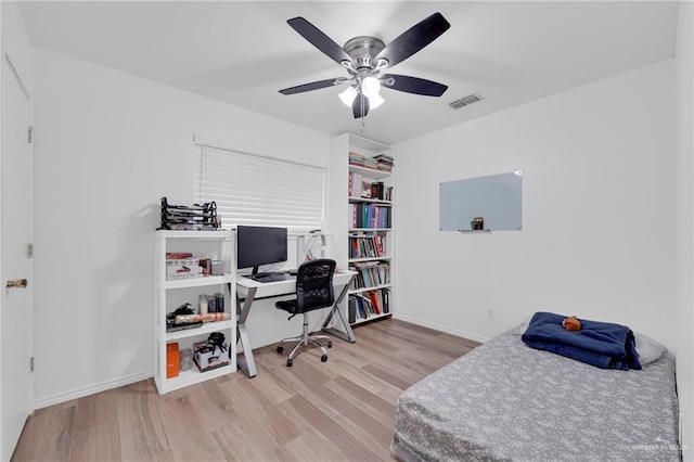 1103 Sun Valley St, San Juan, TX 78589 - bedroom featuring wood finished floors, a desk, baseboards, and a ceiling fan