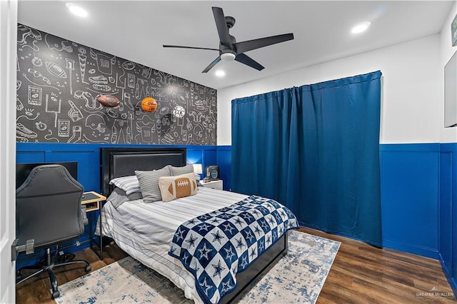 1801 E 28th St, Mission, TX 78574 - bedroom featuring wood finished floors, recessed lighting, ceiling fan, and wainscoting