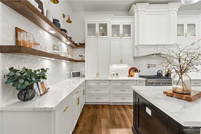 1801 E 28th St, Mission, TX 78574 - kitchen featuring open shelves, white cabinets, gas range, dark wood finished floors, and backsplash