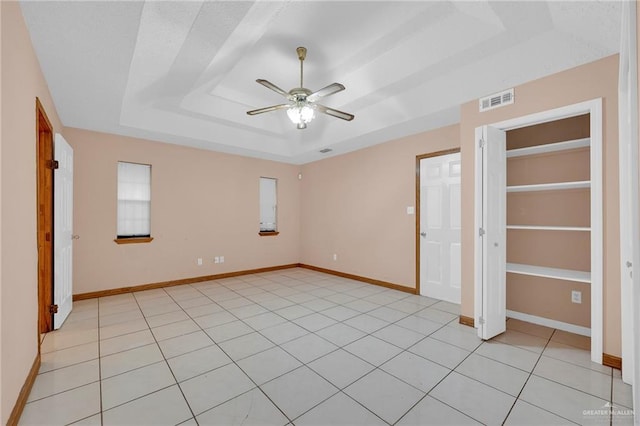 4113 Sonora Ave, Mcallen, TX 78503 - unfurnished bedroom with visible vents, baseboards, a raised ceiling, and light tile patterned floors