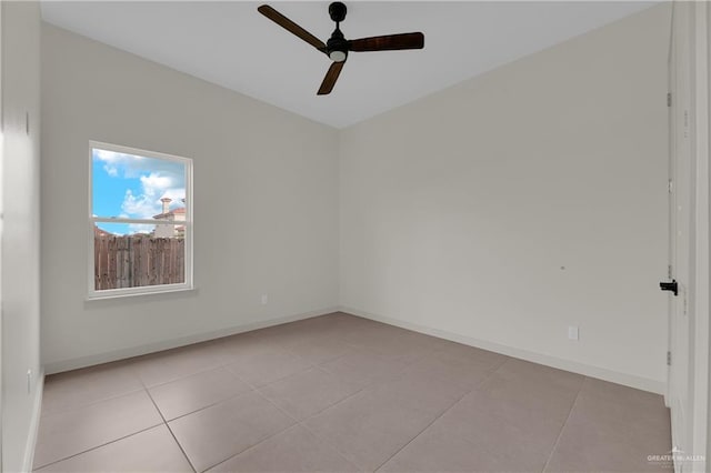 4712 S Waterford Ave, Edinburg, TX 78539 - spare room with ceiling fan, light tile patterned floors, and baseboards