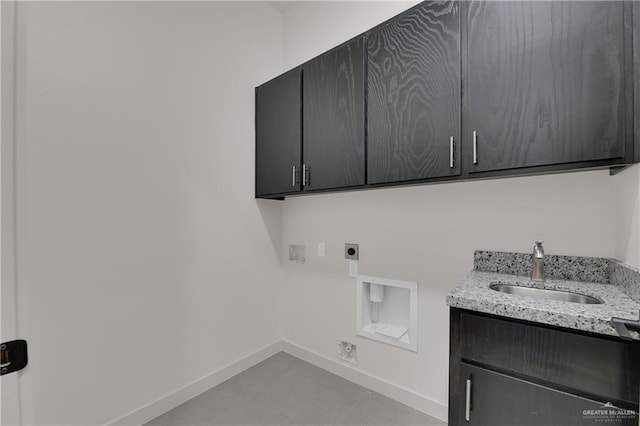 4712 S Waterford Ave, Edinburg, TX 78539 - laundry room with cabinet space, hookup for an electric dryer, baseboards, and hookup for a washing machine