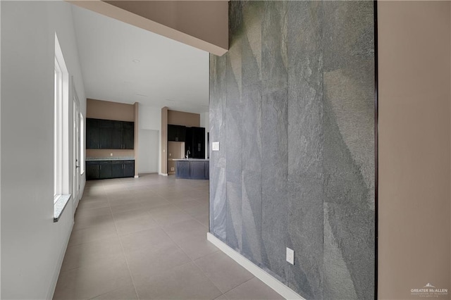 4712 S Waterford Ave, Edinburg, TX 78539 - hallway featuring light tile patterned floors and baseboards