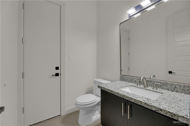4712 S Waterford Ave, Edinburg, TX 78539 - bathroom featuring vanity, toilet, tile patterned flooring, and baseboards