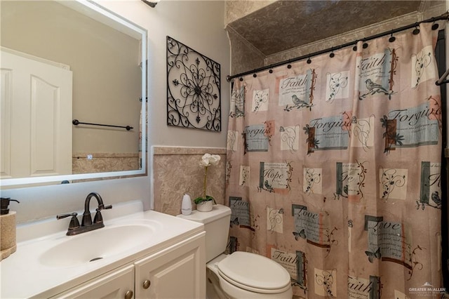 bathroom featuring a shower with curtain, vanity, tile walls, and toilet