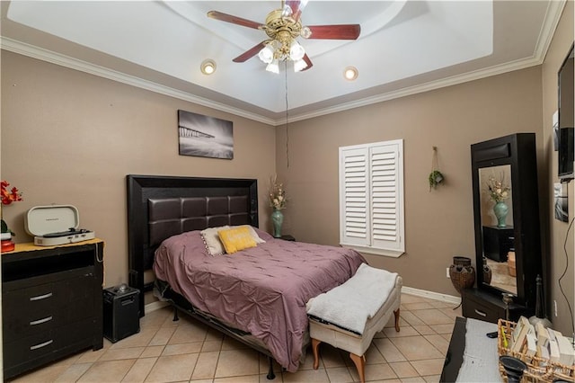 tiled bedroom with a raised ceiling, ornamental molding, and ceiling fan