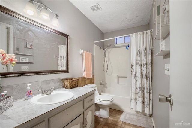 bathroom with a textured ceiling, toilet, vanity, visible vents, and shower / bath combination with curtain