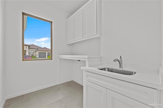 washroom featuring cabinets and sink