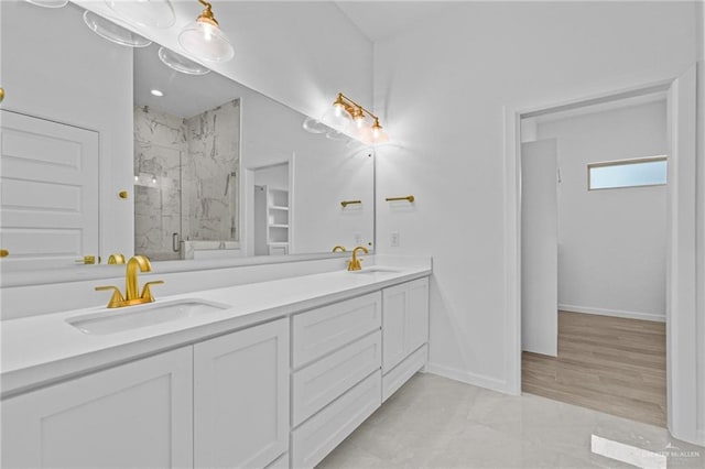 bathroom with vanity and an enclosed shower