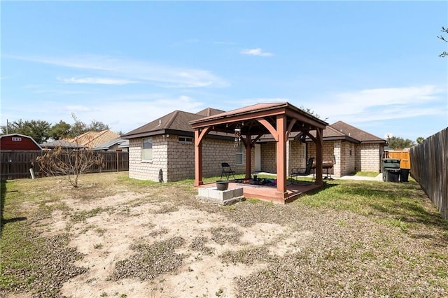 view of yard with a fenced backyard and a gazebo