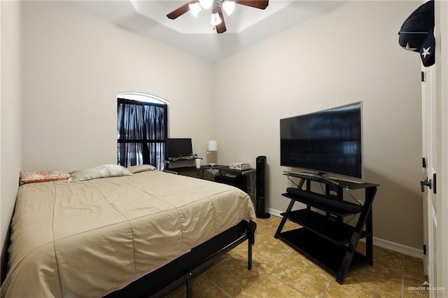 bedroom featuring ceiling fan and baseboards